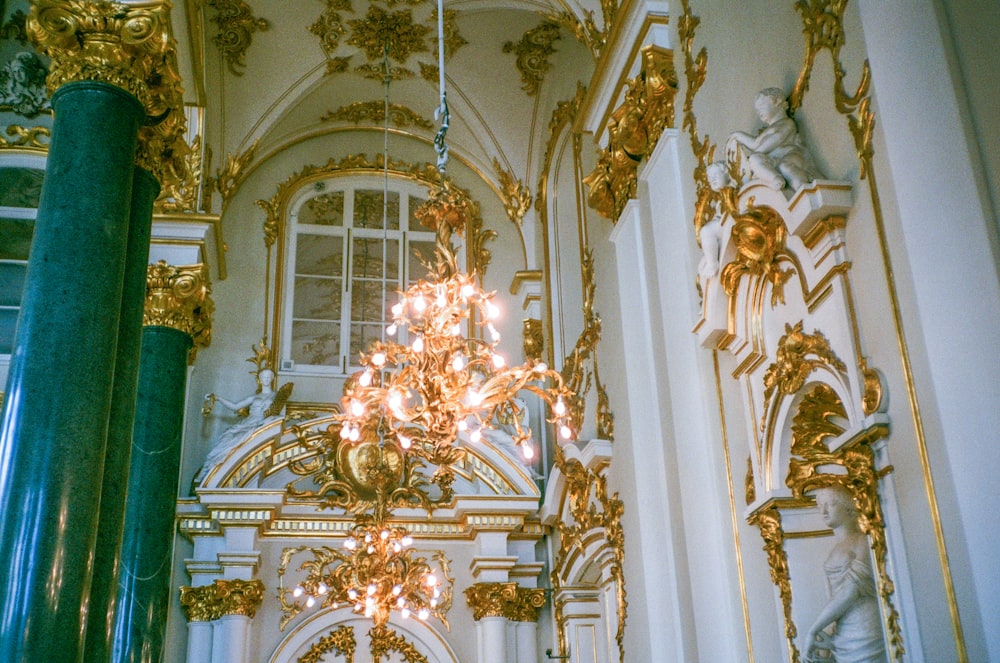 gold and white uplight chandelier