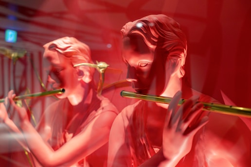 woman in black tank top holding green stick