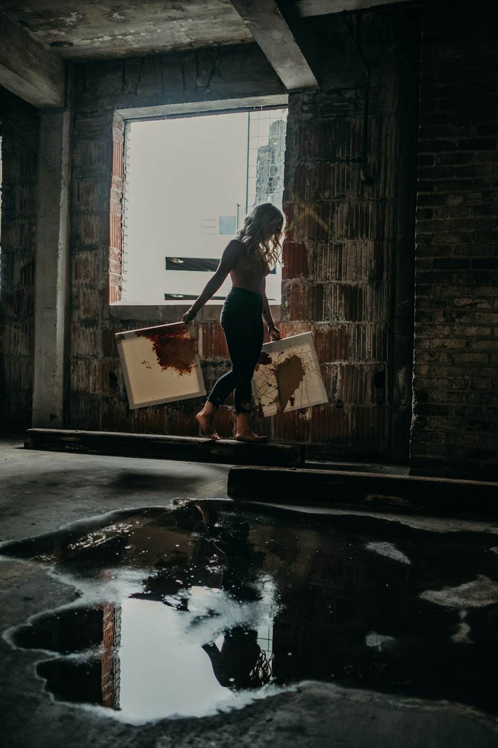 woman in black tank top and black pants standing on water