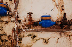 blue propane tank on brown wooden table