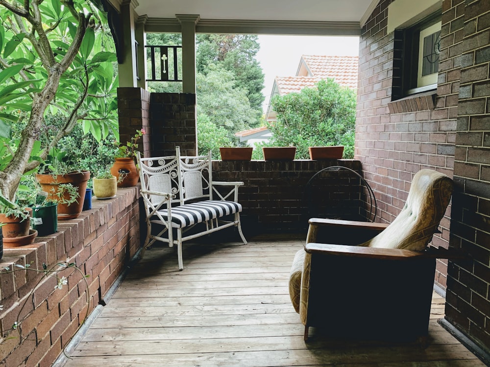 brown and white wicker armchairs