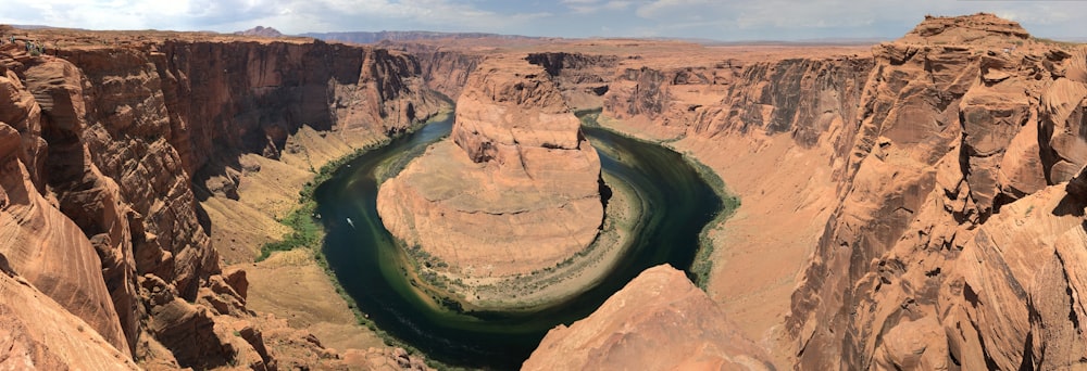 brown rock formation near green river during daytime