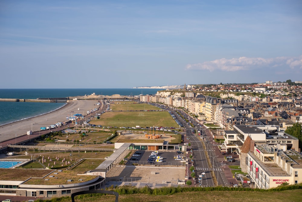 aerial view of city buildings near sea during daytime