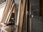 brown wooden ladder leaning on wall