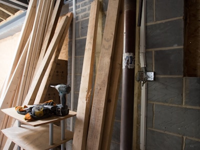 Tools and materials for wall covering and plastering neatly arranged at a construction site.