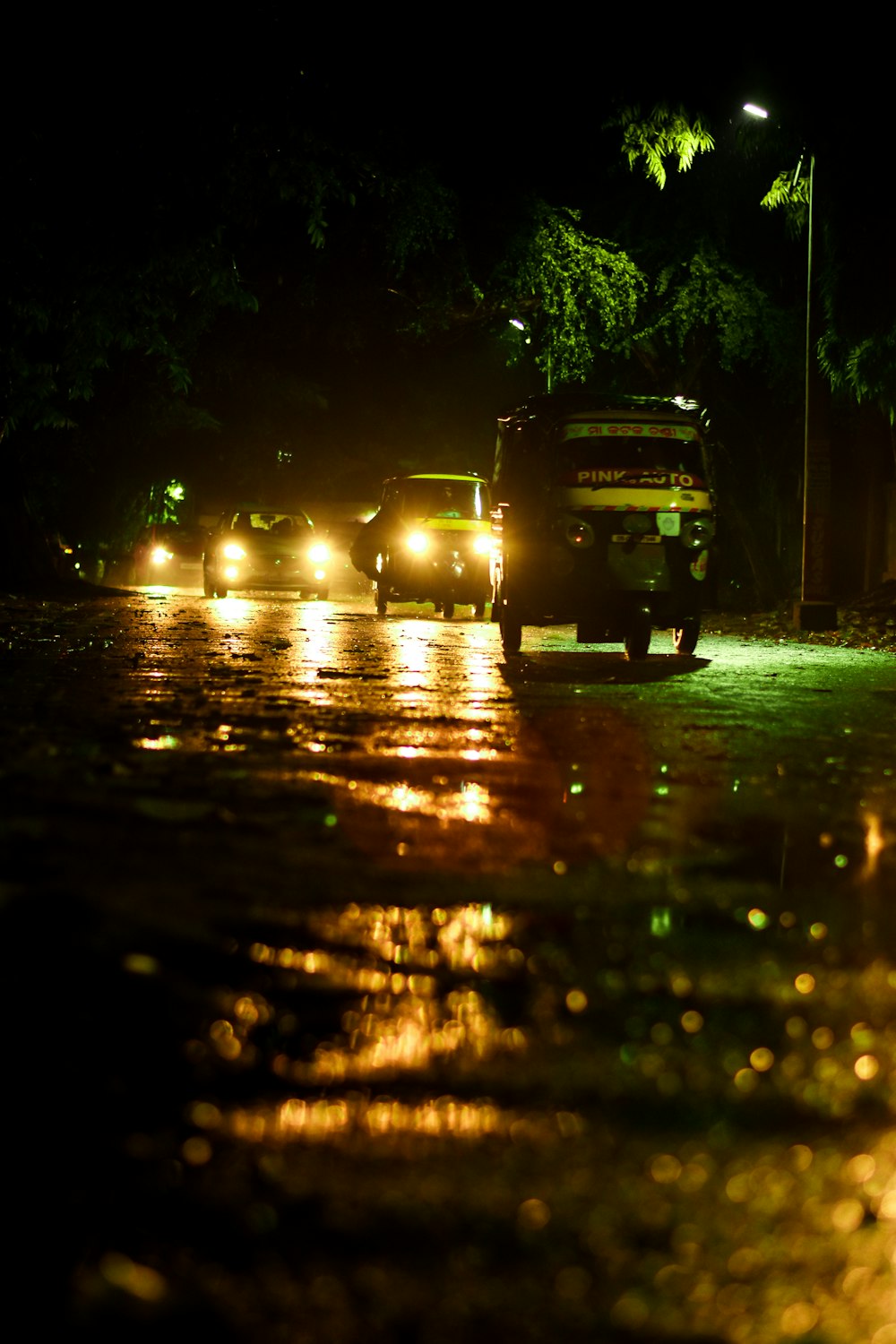 black car on road during night time