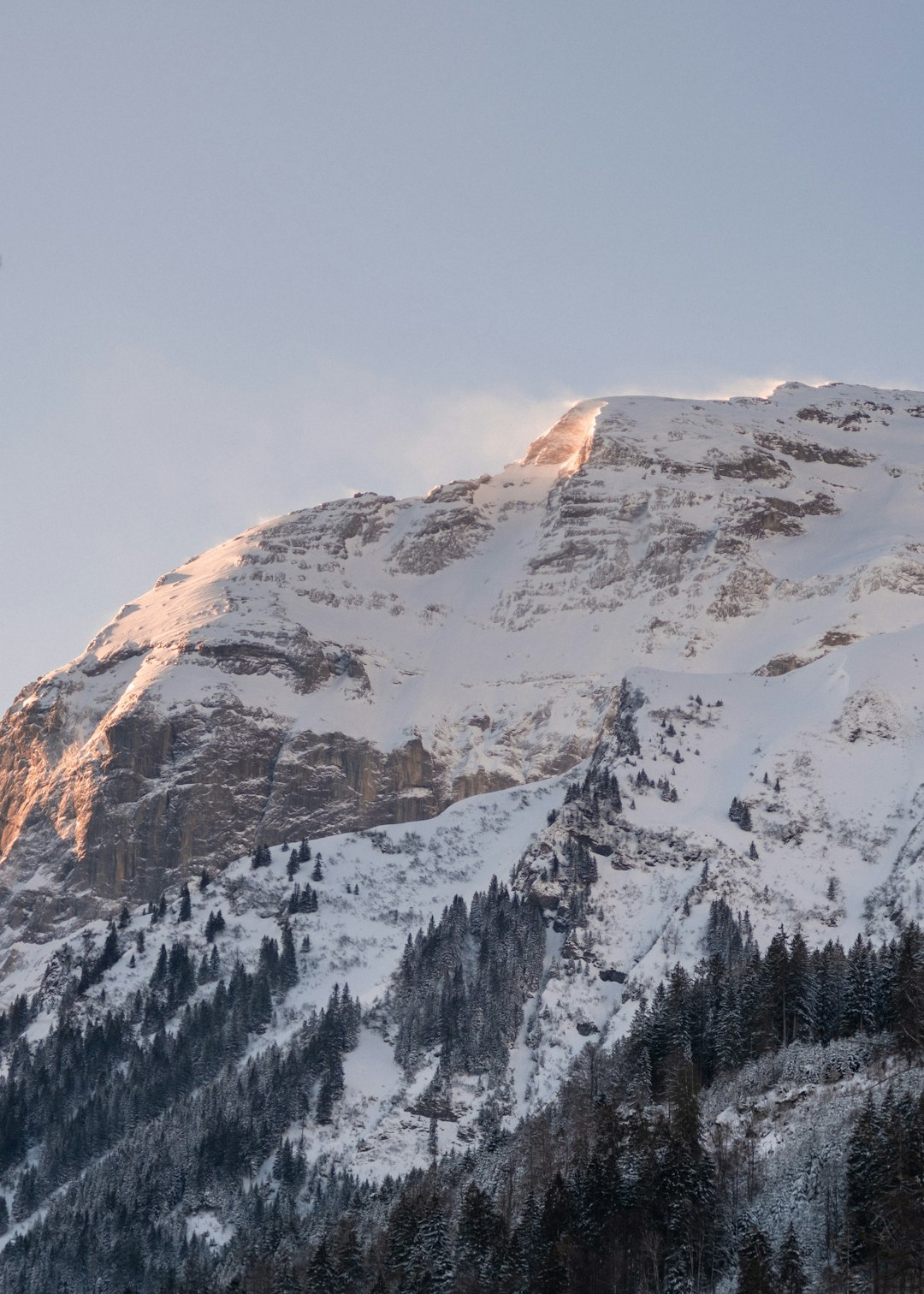 snow covered mountain during daytime