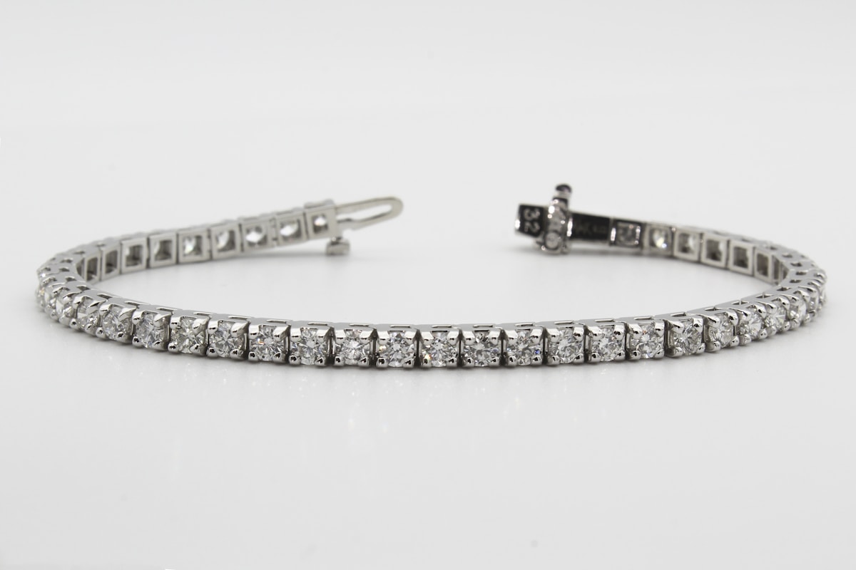 Vesta Tennis Bracelet - linked claw-set diamonds on platinum