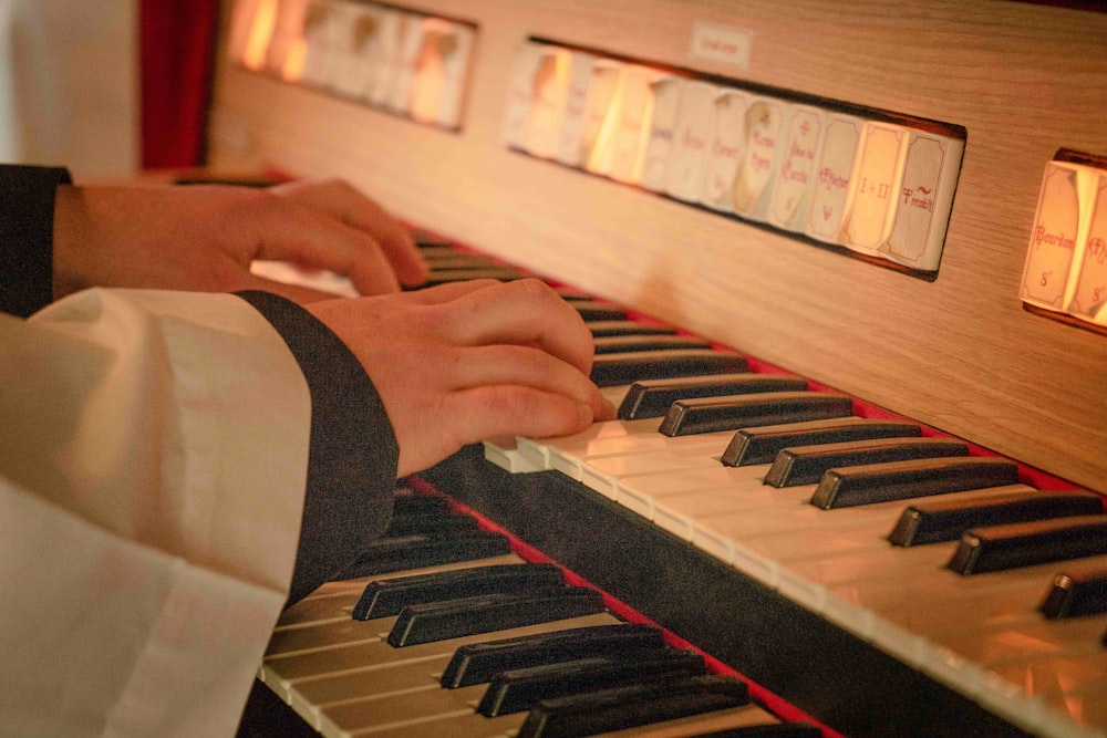 person playing piano in room