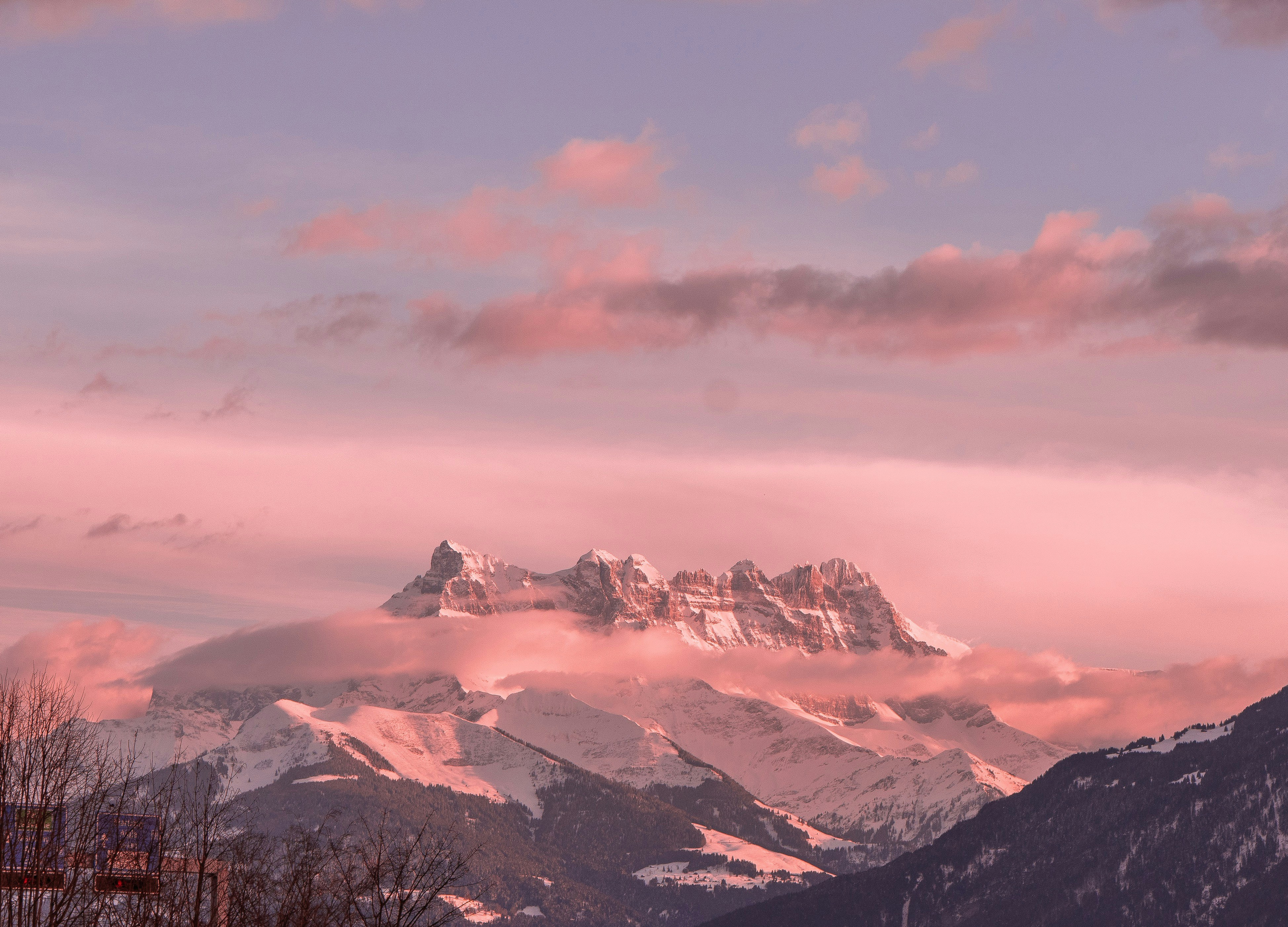 snow covered mountains under cloudy sky during daytime