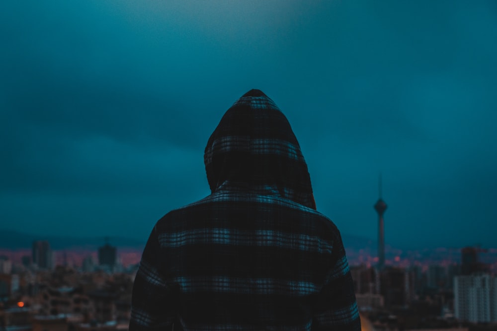 person in black and red plaid hoodie