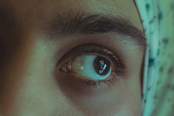 Before and after photos side by side highlighting subtle, precise eyebrow enhancement.