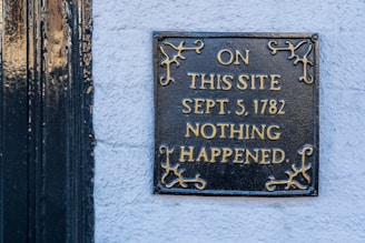 Sign reading 'On this site nothing happened,' symbolizing missed opportunities in HIV prevention for