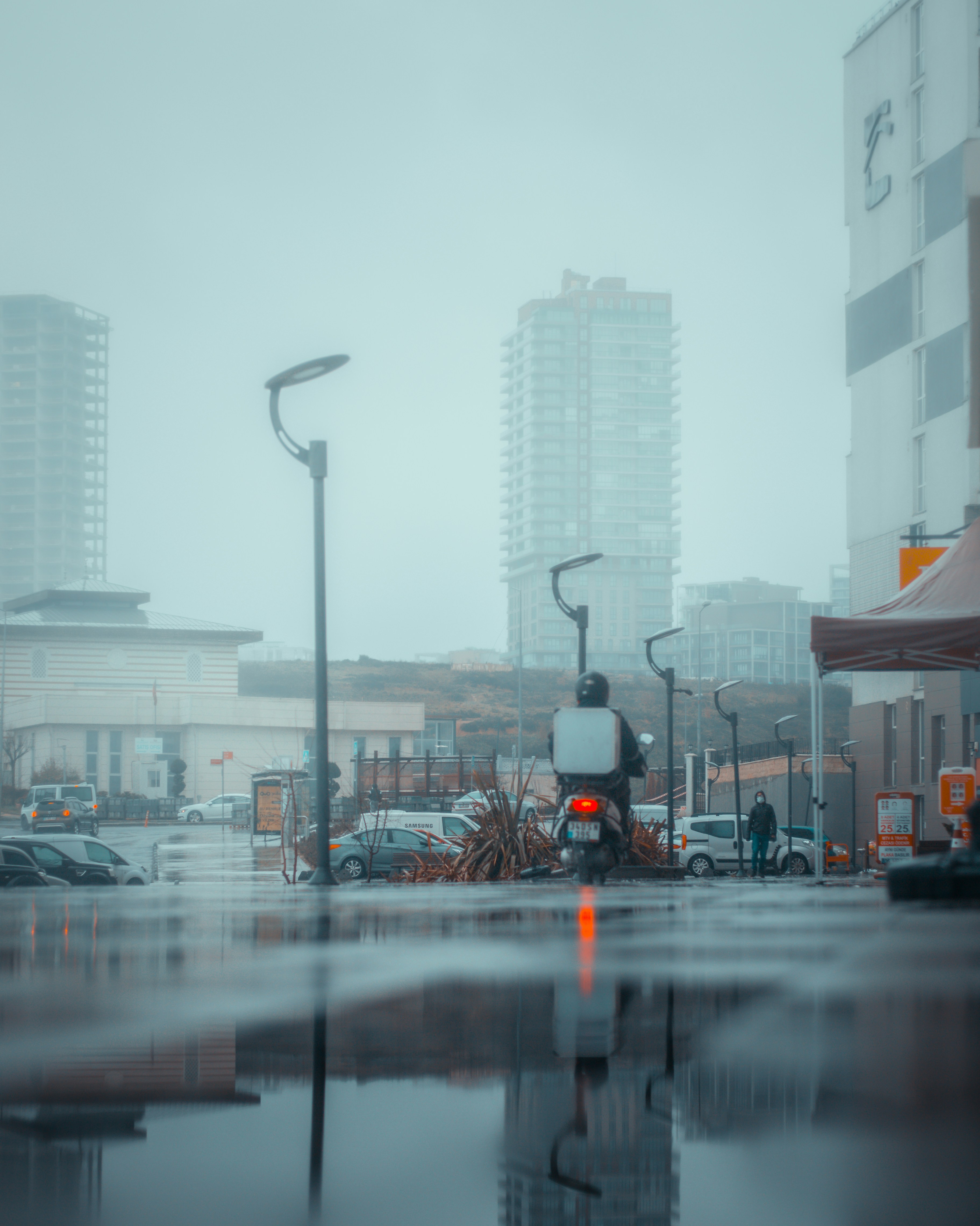 cars on road near buildings during daytime
