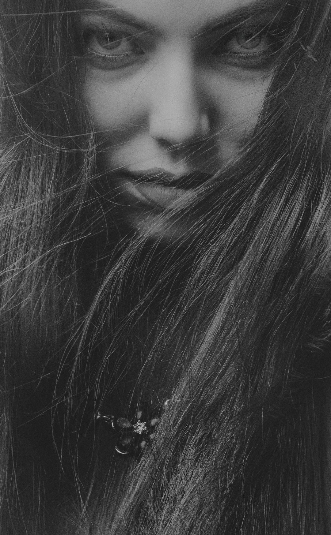 woman in black shirt with silver necklace