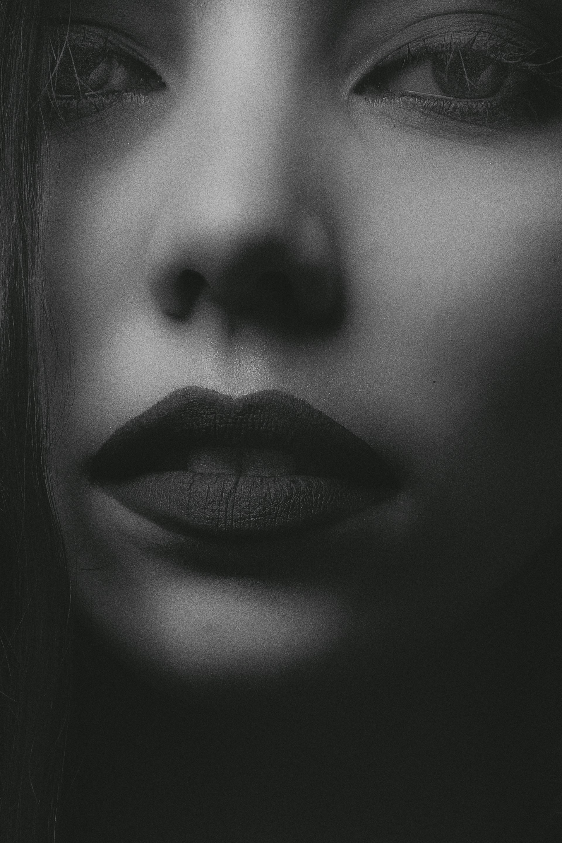 grayscale photo of womans face