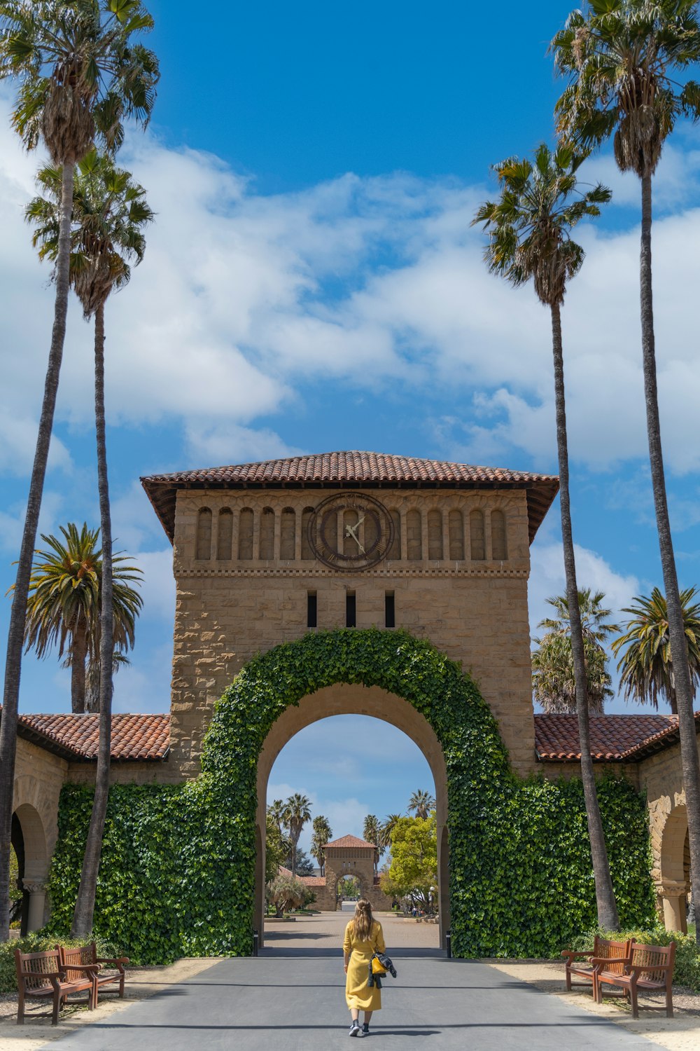 brown concrete arch under cloudy sky during daytime