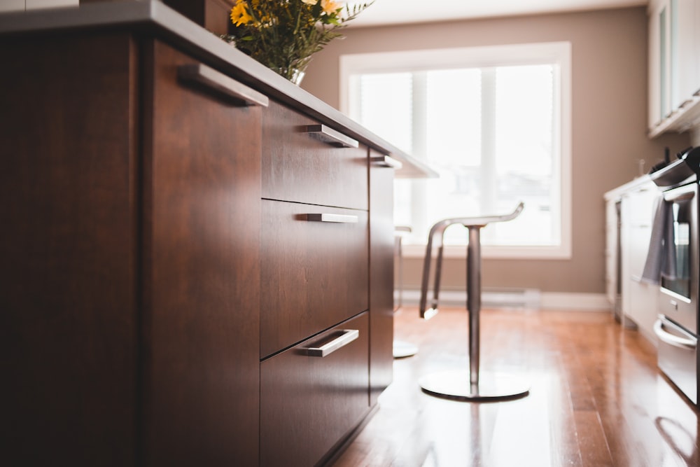 brown wooden cabinet near brown wooden door