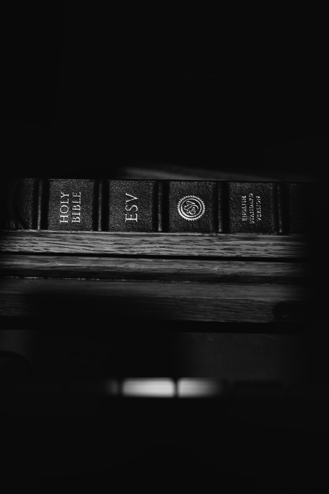 black and brown books on brown wooden table