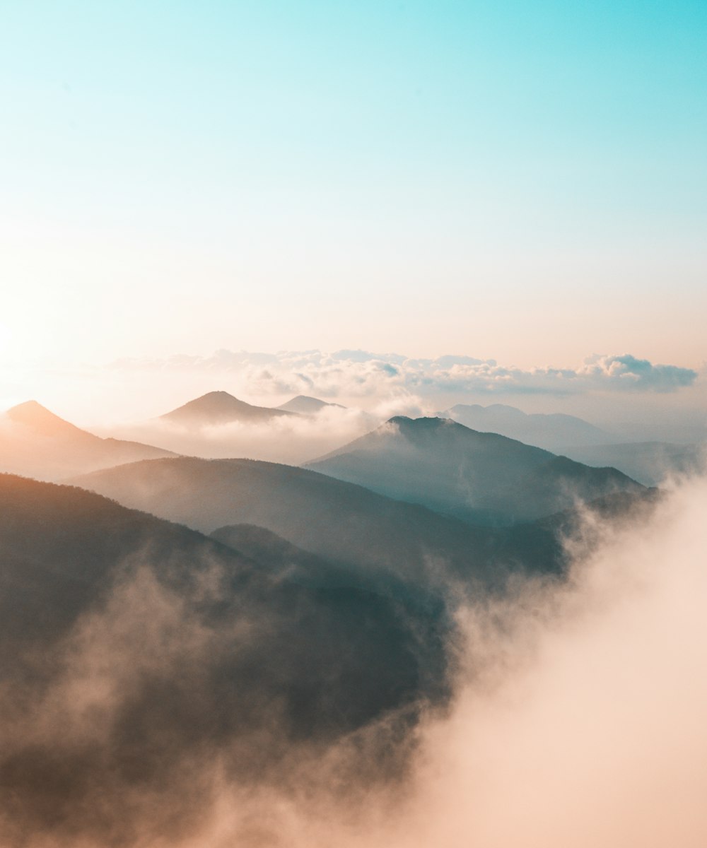 black mountains under white clouds during daytime