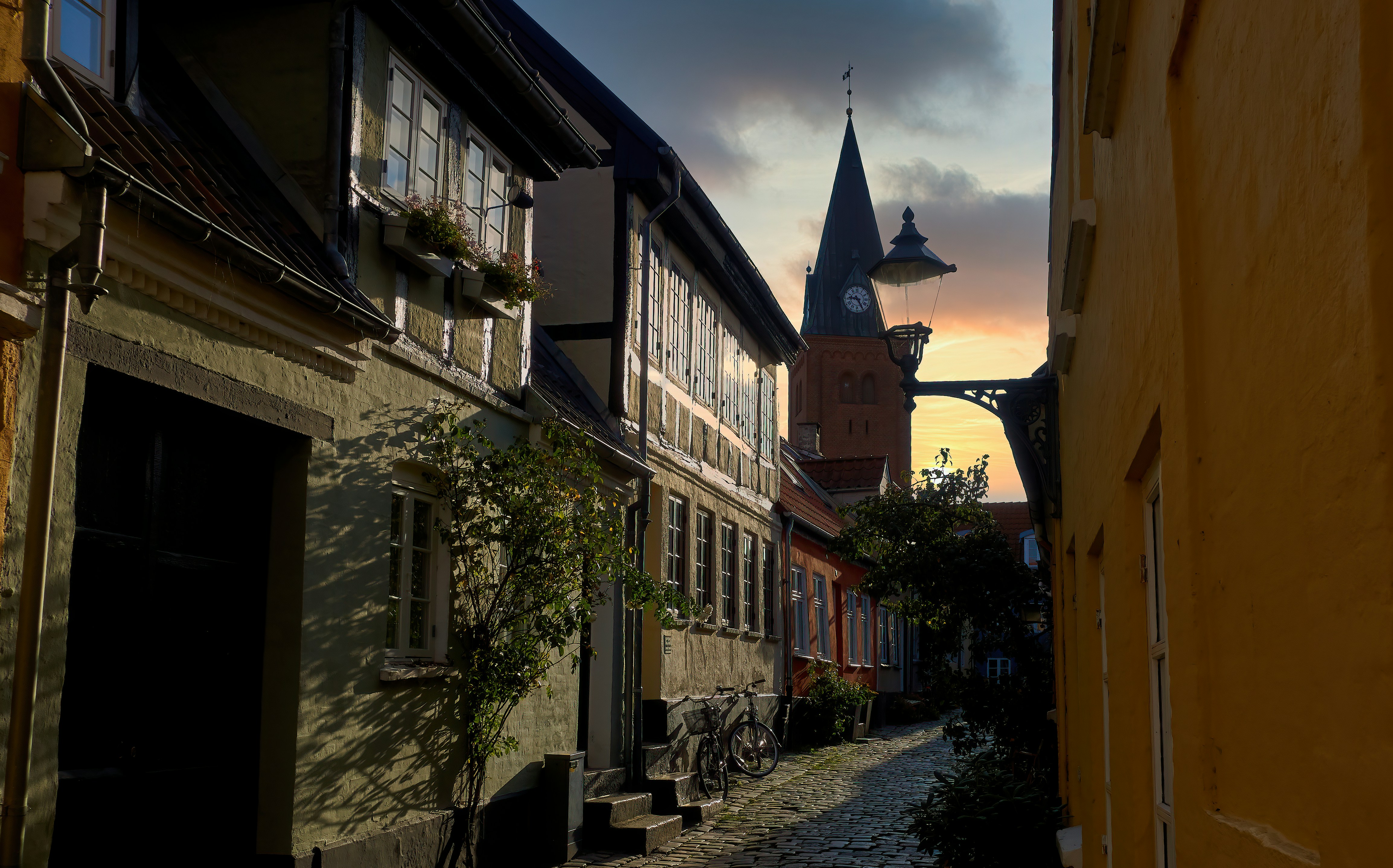 Narrow urban street during sunset