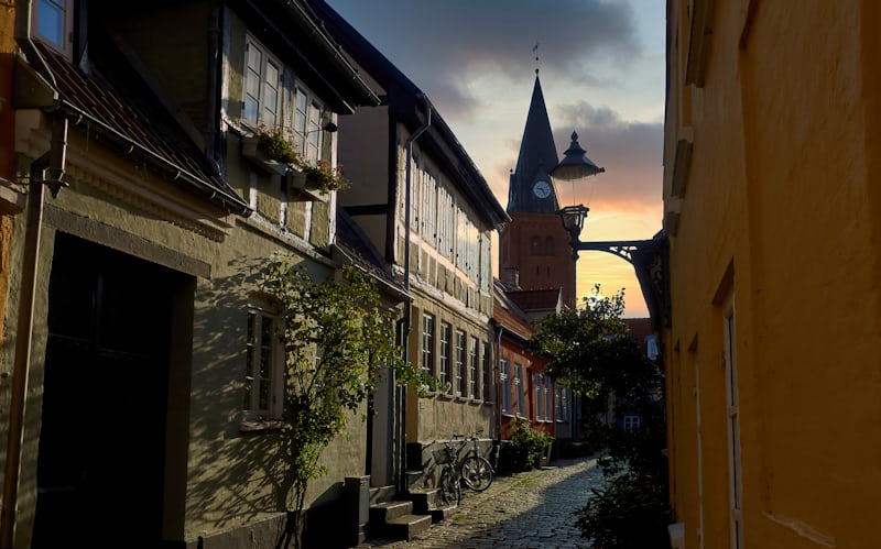 Narrow urban street during sunset