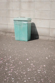 Close-up of sparkling clean trash bin with mist of fresh aroma in a green backyard.
