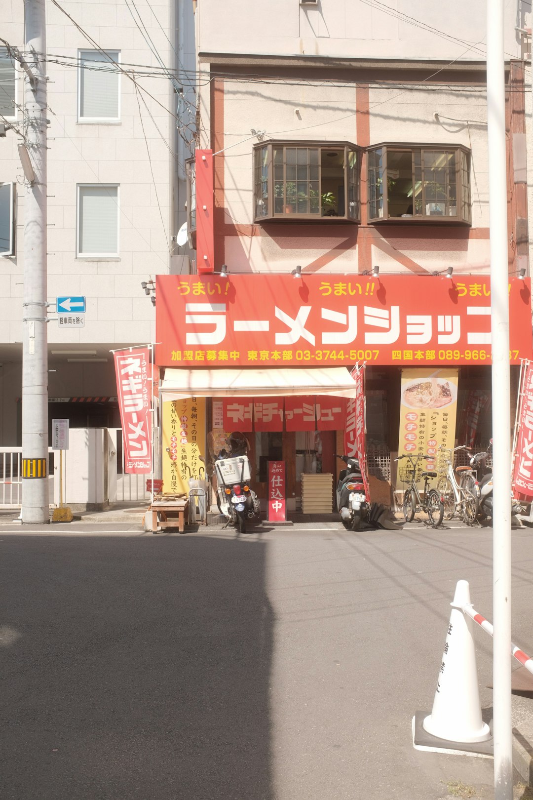 cars parked in front of store during daytime