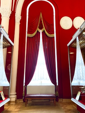 Luxurious interior shot of a private vault with plush navy blue walls and gold trim.