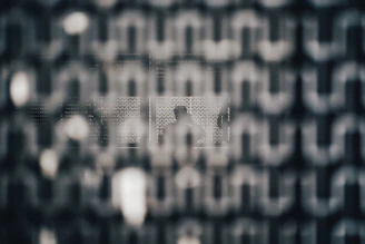 An abstract neural grid background with thin luminous borders and subtle motion effects.