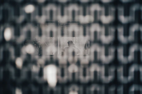 An abstract neural grid background with thin luminous borders and subtle motion effects.