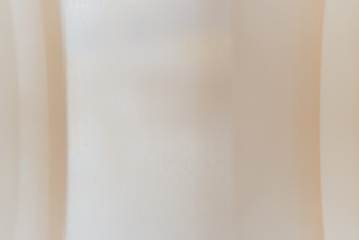 Natural textured background with subtle, neutral colors reflecting sophistication.