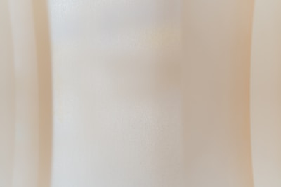 Natural textured background with subtle, neutral colors reflecting sophistication.