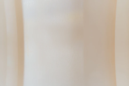 Soft beige abstract shapes layered with subtle textures reflecting warmth and connection.