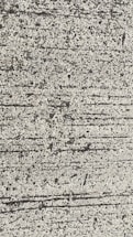 A close-up view of textured concrete with visible lines and small pebbles embedded in the surface.