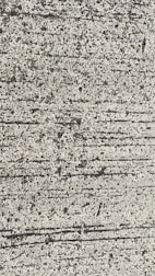 A close-up view of textured concrete with visible lines and small pebbles embedded in the surface.