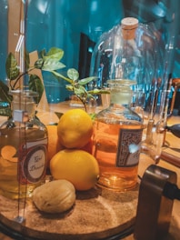 Glass bottles filled with golden cold-pressed oils arranged neatly on a natural linen cloth