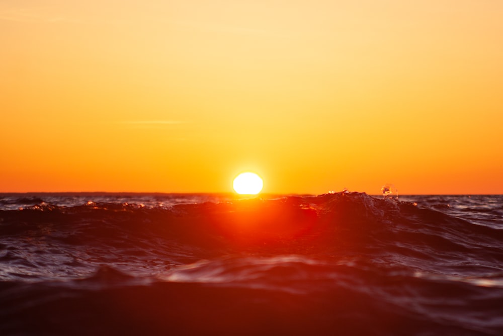 body of water during sunset