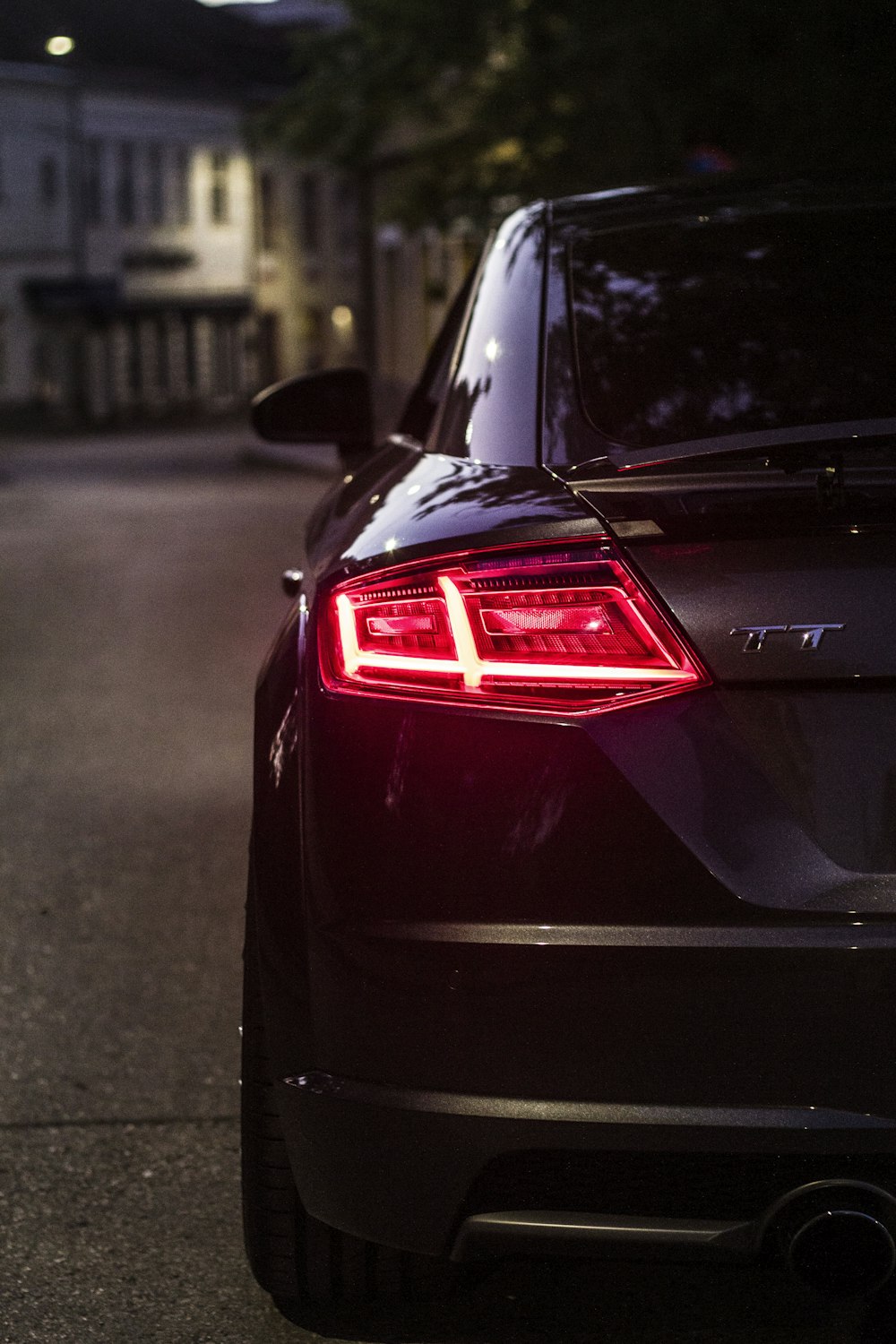 black car on road during night time