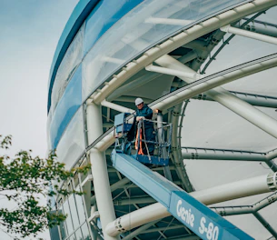 people walking on white and blue glass building during daytime