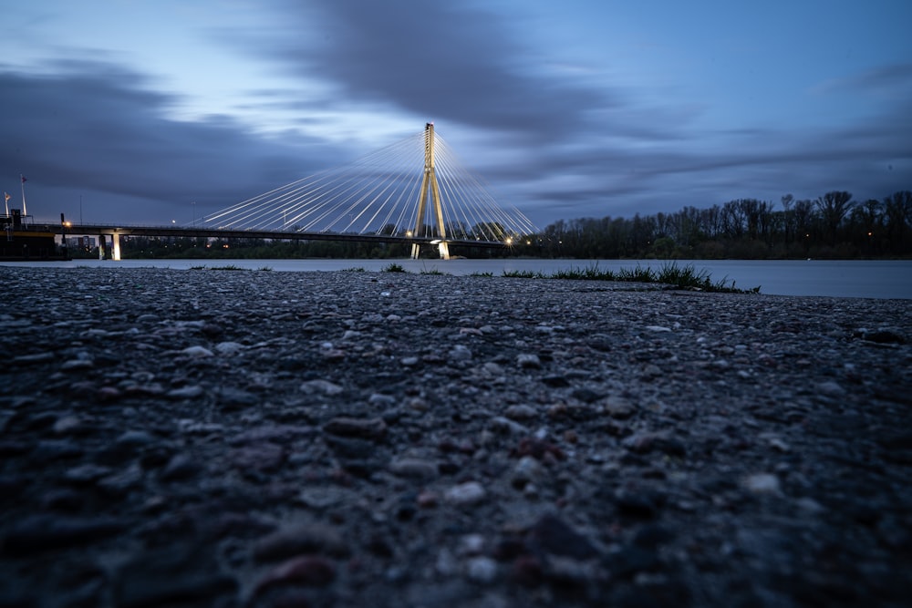 bridge over body of water during night time