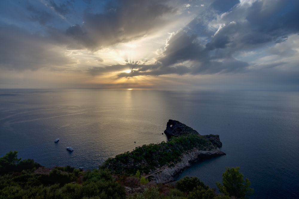 body of water under cloudy sky during daytime