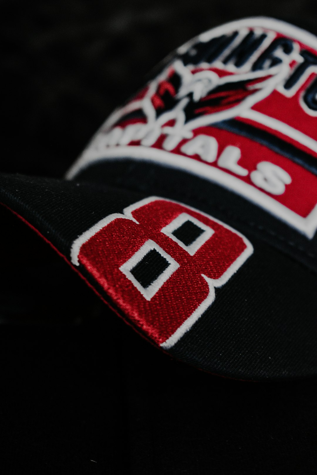 black red and white fitted cap