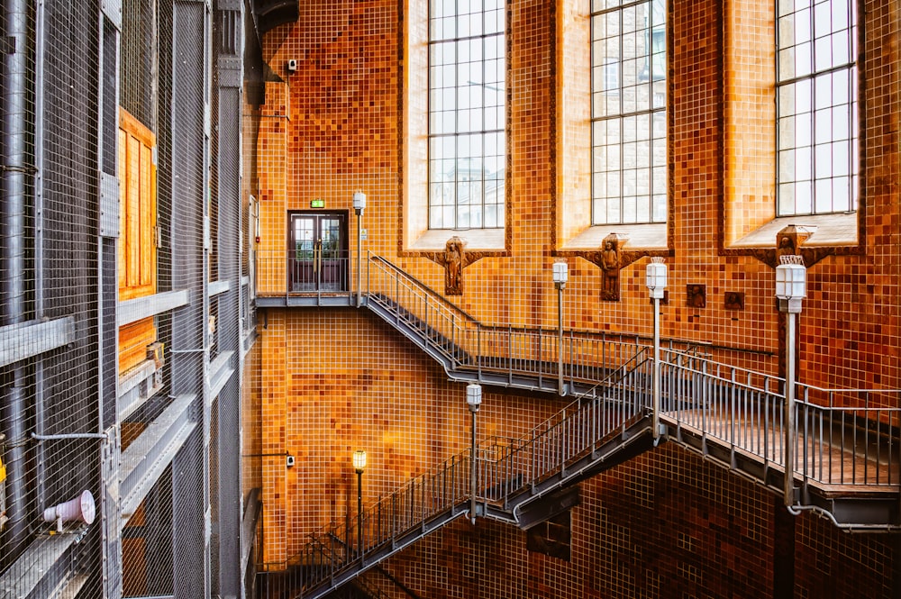 brown brick building with black metal window grill