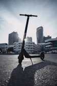 A sleek electric scooter parked in an urban setting.