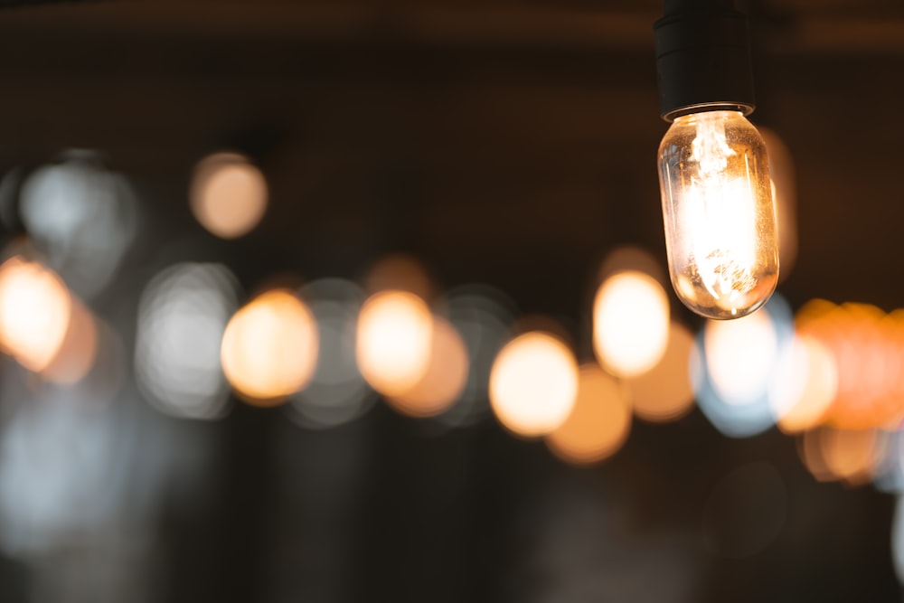 bokeh photography of lighted lamp