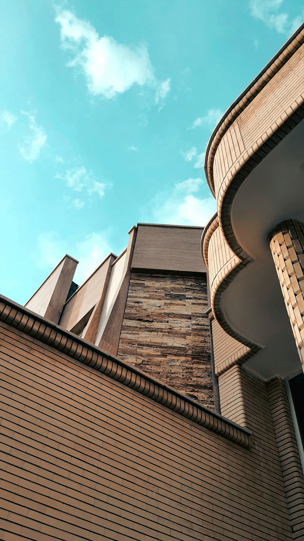 brown concrete building under blue sky during daytime