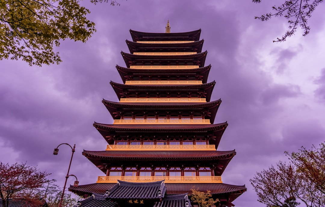 brown and white pagoda temple under blue sky during daytime