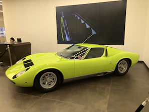 Friendly staff member greeting a customer at the Go Car Motors reception desk