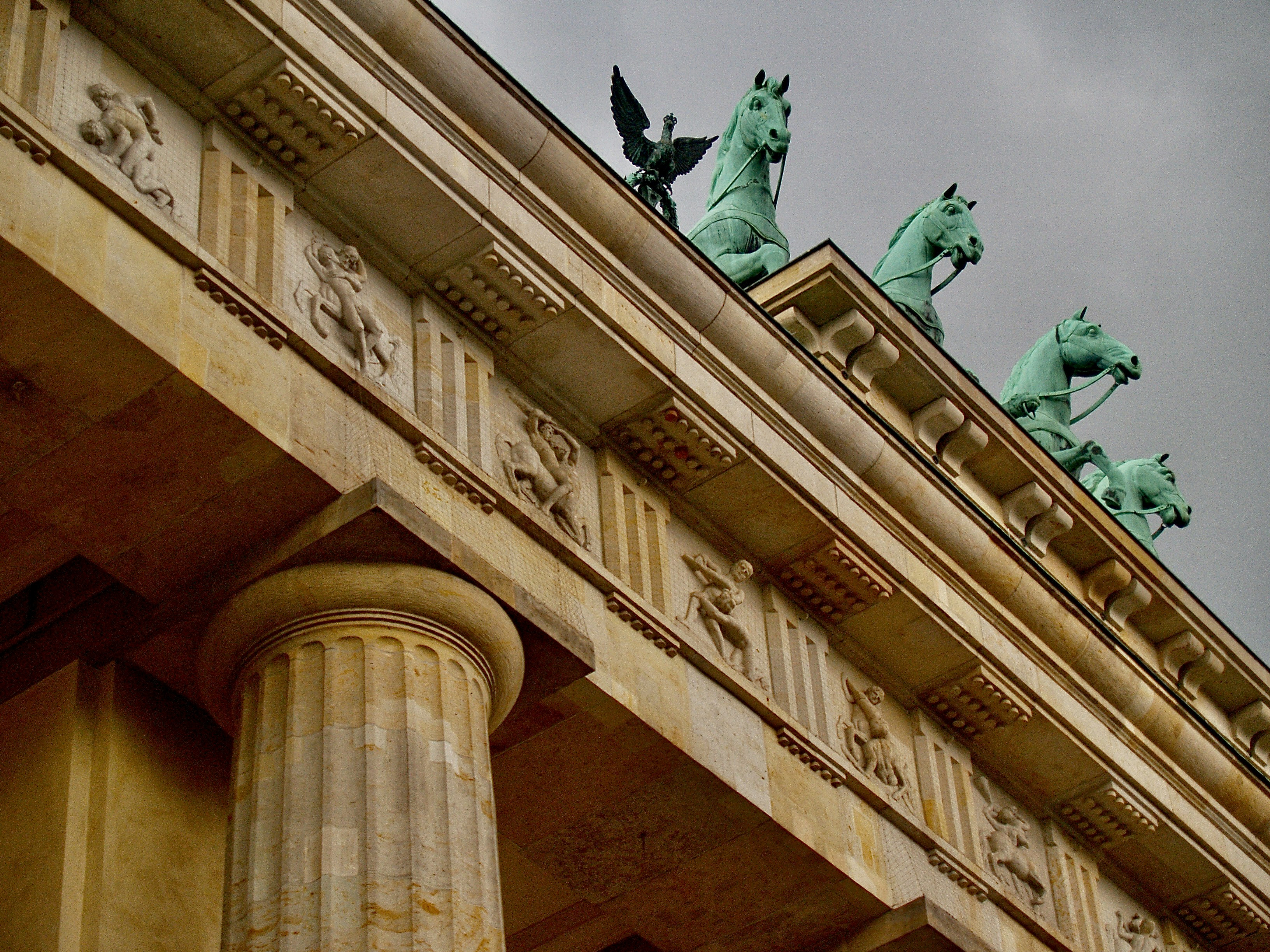 man riding horse statue on top of building